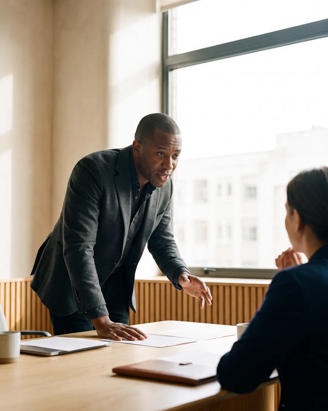 A senior CFO reviewing the work in a calm Jersey boardroom